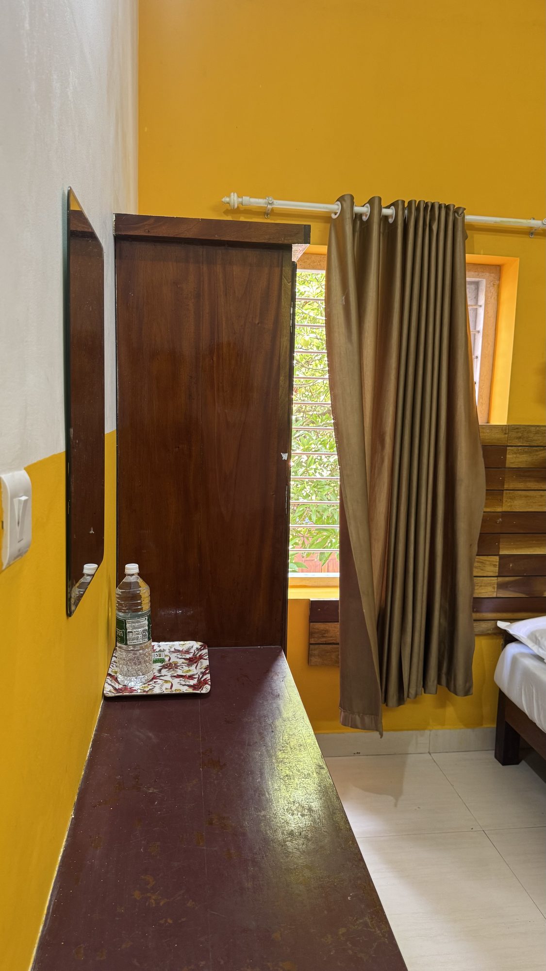 Table, shelf and curtain at Jumayira International hotel